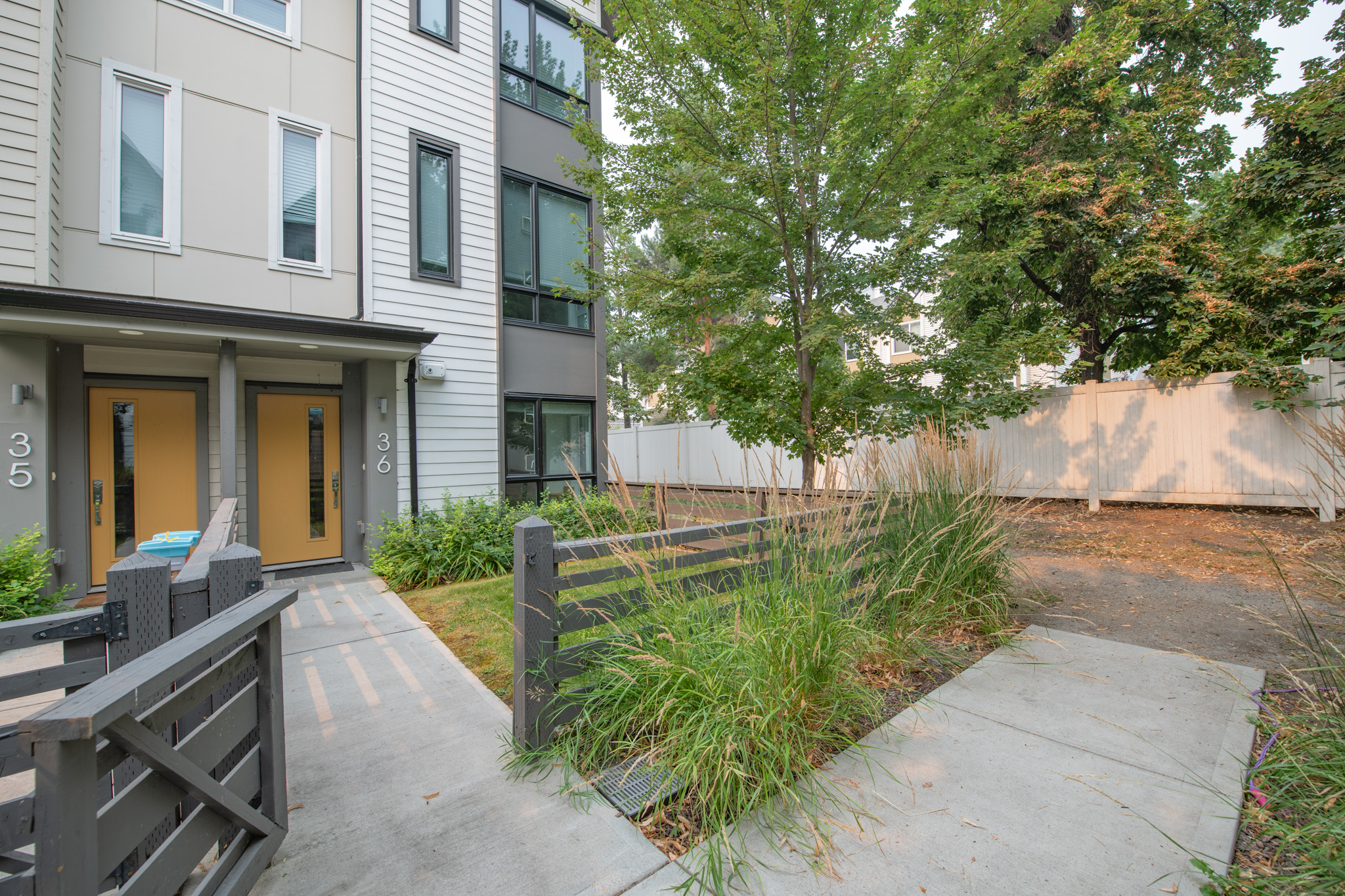Landscaped entrance to end unit 36 beside the walking path