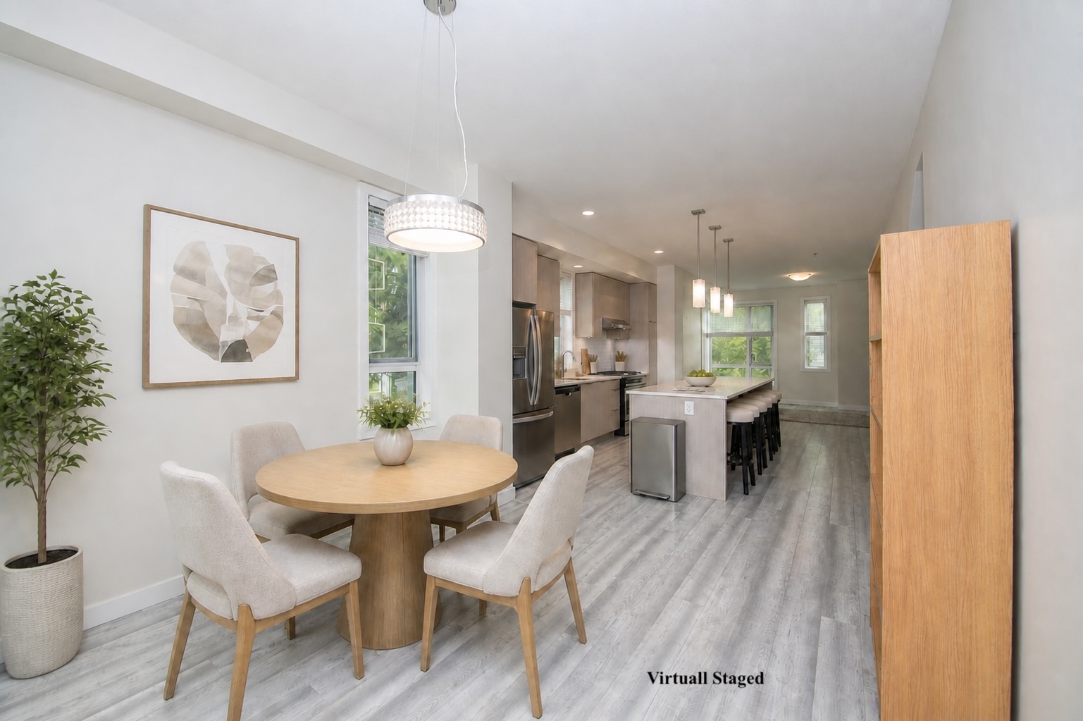 Virtually staged dining area overlooking the open kitchen