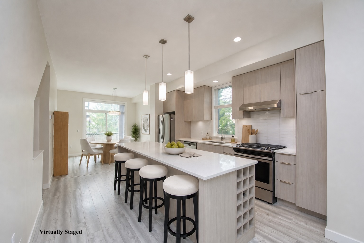 Virtually staged kitchen with large island and gas range